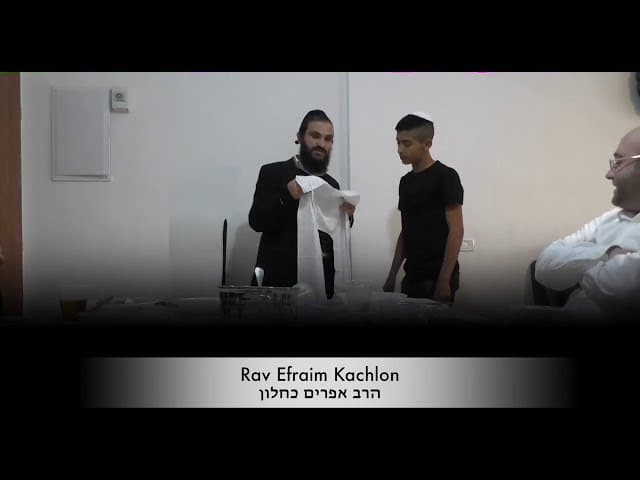 Rav Efraim and Rav Yaron giving out tzitzit around the world